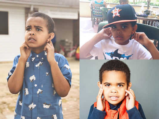 Why does he cover his ears?